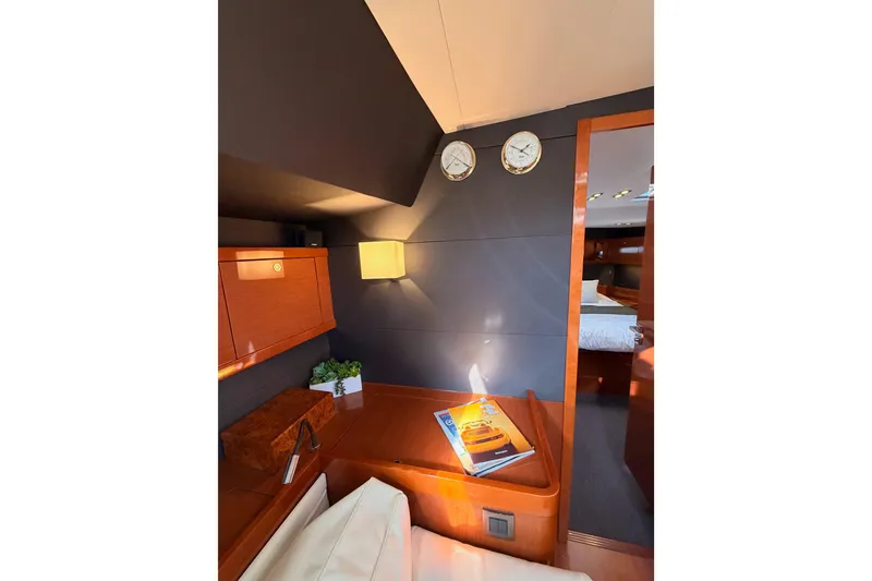 Slide: The Image of Luxurious interior of 2015 Beneteau Oceanis Yacht 60 with elegant wood finish and modern decor. - 79