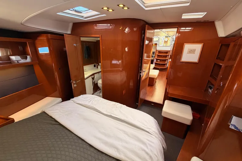 Slide: The Image of Luxurious interior of 2015 Beneteau Oceanis Yacht 60 with wood finish and cozy bedroom. - 84