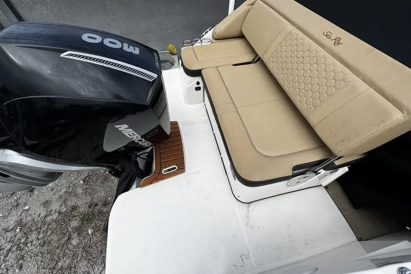 Slide: The Image of 2019 Sea Ray SDX 250 boat with beige seating and Mercury outboard motor. - 24
