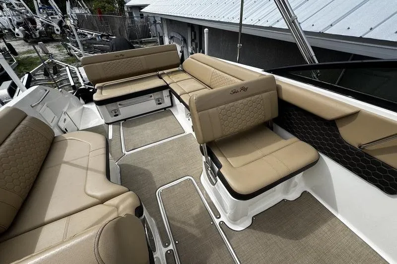 Slide: The Image of 2019 Sea Ray SDX 250 boat interior with beige seating and spacious layout. - 27