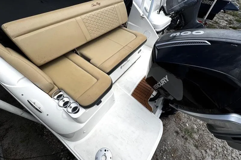 Slide: The Image of 2019 Sea Ray SDX 250 boat with tan seating and Mercury outboard engine. - 28