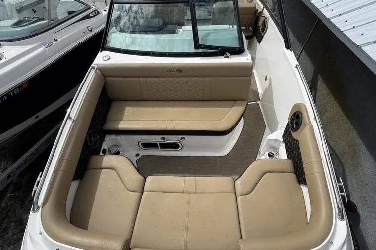 Slide: The Image of 2019 Sea Ray SDX 250 boat interior with beige seating and modern design. - 8