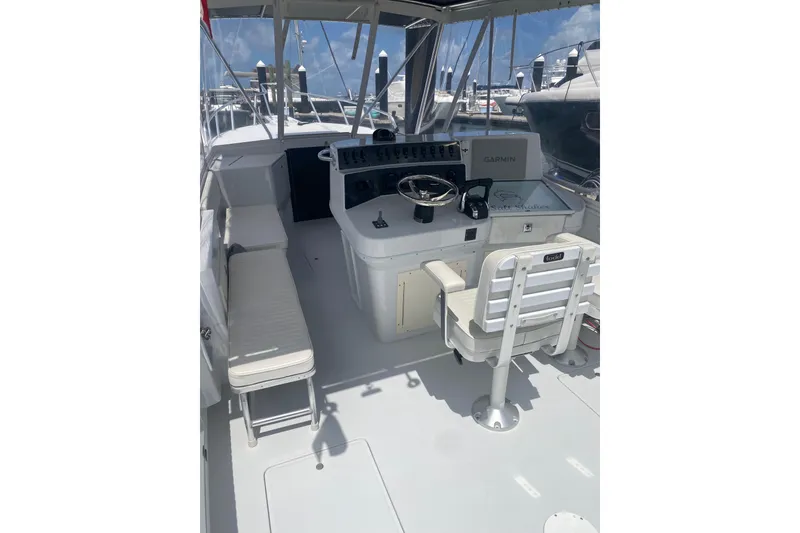 Slide: The Image of Helm of 1990 Salt Shaker 300 boat with steering wheel and seating. - 12