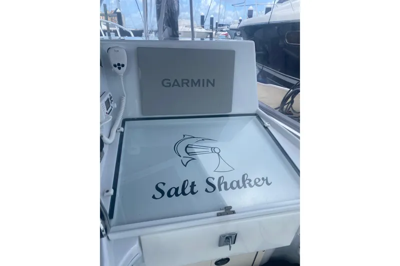 Slide: The Image of Control panel of a 1990 Salt Shaker 300 boat with Garmin equipment. - 5