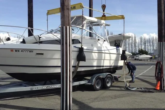 Slide: The Image of 1998 Bayliner 2655 Ciera Sunbridge on trailer at marina, being prepared for launch. - 10