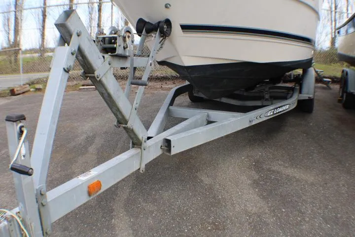 Slide: The Image of 1998 Bayliner 2655 Ciera Sunbridge on trailer, parked outdoors. - 11