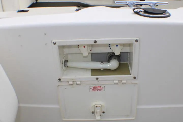 Slide: The Image of 1998 Bayliner 2655 Ciera Sunbridge boat shower compartment with faucet controls. - 18