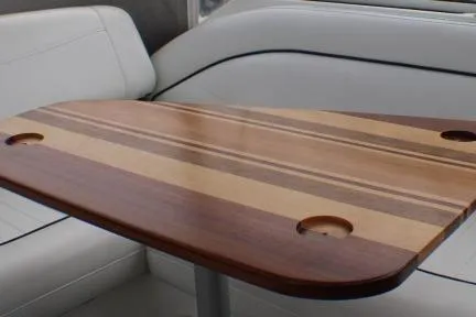 Slide: The Image of 1998 Bayliner 2655 Ciera Sunbridge interior with wooden table and white seating. - 30