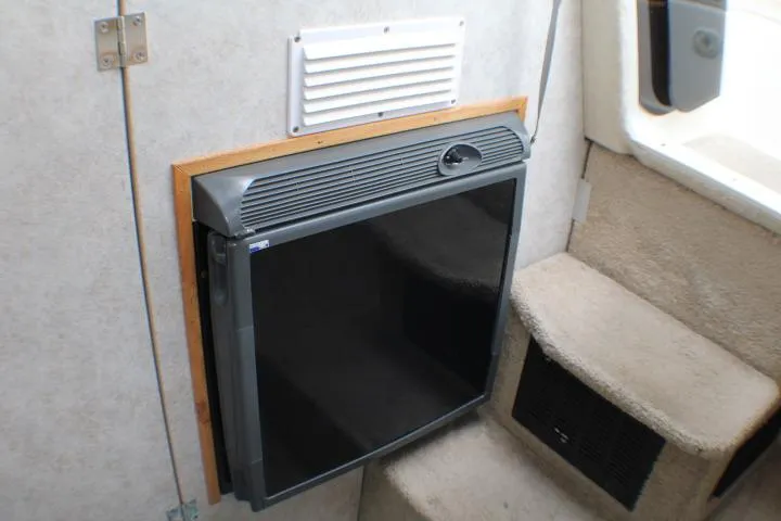 Slide: The Image of 1998 Bayliner 2655 Ciera Sunbridge interior with compact refrigerator. - 47