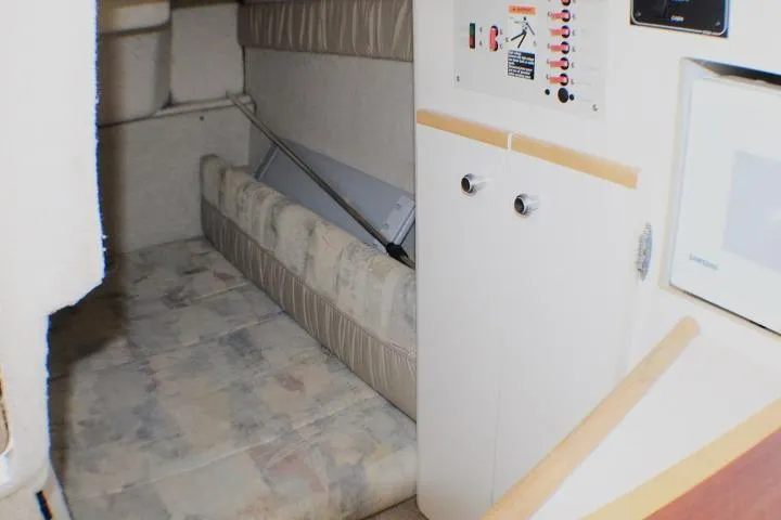 Slide: The Image of Interior cabin of a 1998 Bayliner 2655 Ciera Sunbridge with seating and control panel. - 52
