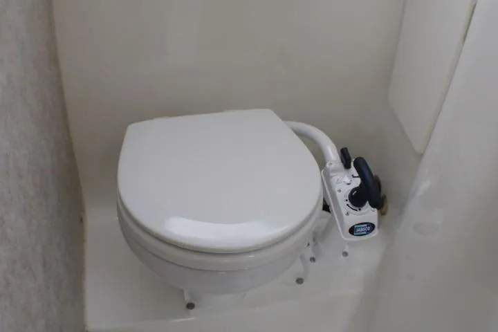 Slide: The Image of Marine toilet in 1998 Bayliner 2655 Ciera Sunbridge boat bathroom. - 58