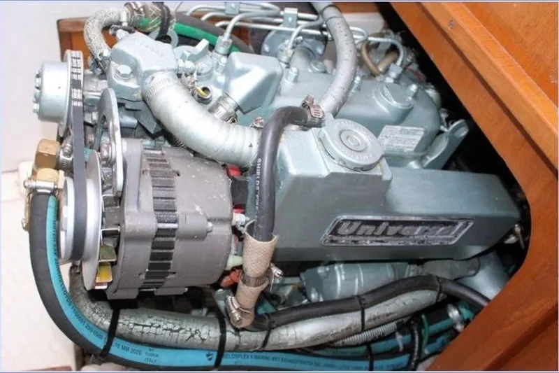 Slide: The Image of Engine compartment of a 2001 Catalina 36 MkII sailboat, featuring a Universal diesel engine. - 11
