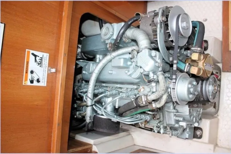 Slide: The Image of Engine compartment of a 2001 Catalina 36 MkII sailboat, showcasing mechanical components. - 12