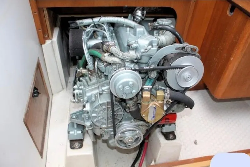 Slide: The Image of Engine of a 2001 Catalina 36 MkII sailboat, showcasing mechanical components. - 13