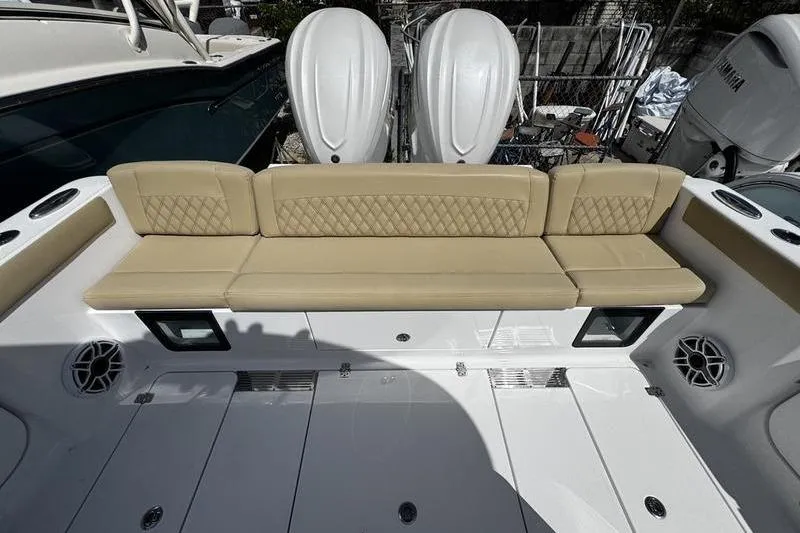 Slide: The Image of 2026 Sportsman Heritage 321 Center Console boat with tan seating and sleek design. - 12