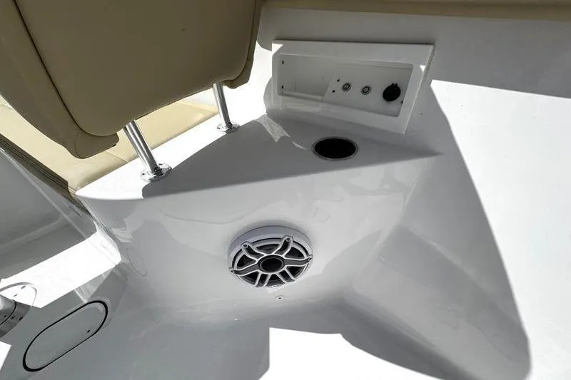 Slide: The Image of 2026 Sportsman Heritage 321 Center Console boat with open storage compartment. - 14