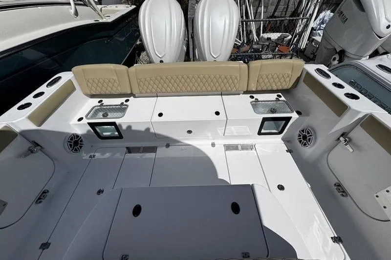 Slide: The Image of Center console of 2026 Sportsman Heritage 321 boat with steering wheel and controls. - 27