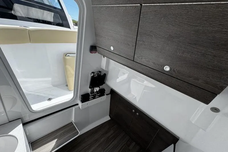 Slide: The Image of 2026 Sportsman Heritage 321 Center Console with luxurious beige seating and modern dashboard. - 29