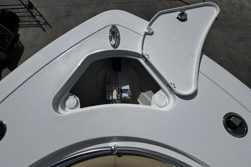 Slide: The Image of 2026 Sportsman Heritage 321 Center Console boat with tan cushioned seating. - 3