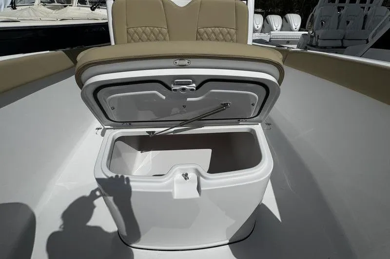 Slide: The Image of 2026 Sportsman Heritage 321 Center Console boat interior with seating and storage compartments. - 34