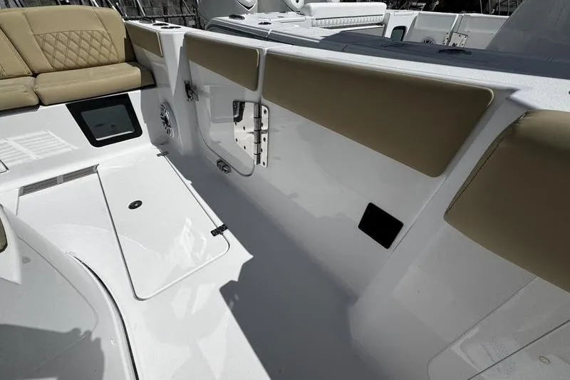 Slide: The Image of 2026 Sportsman Heritage 321 Center Console boat with spacious seating area. - 4