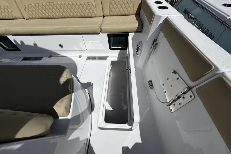 Slide: The Image of 2026 Sportsman Heritage 321 Center Console boat interior with speaker and control panel. - 7
