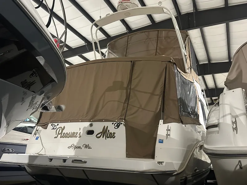 Slide: The Image of 1998 Silverton 351 Sedan in warehouse, brown cover. - 1