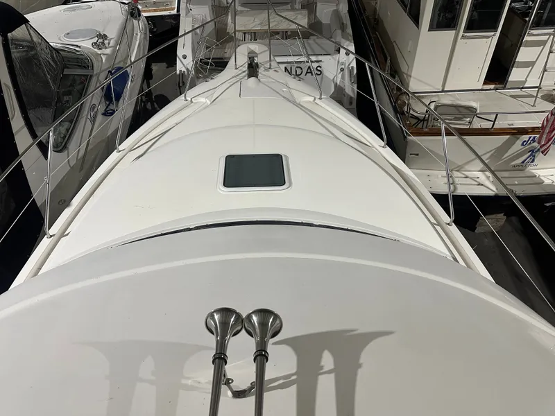 Slide: The Image of 1998 Silverton 351 Sedan yacht in harbor, top view. - 11