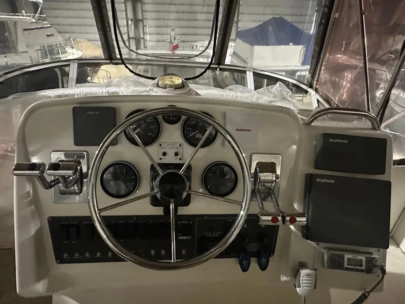 Slide: The Image of 1998 Silverton 351 Sedan helm with navigation instruments. - 12