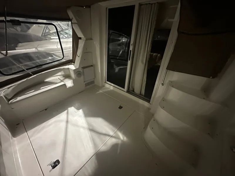 Slide: The Image of Interior of a 1998 Silverton 351 Sedan yacht with stairs and sliding door. - 2