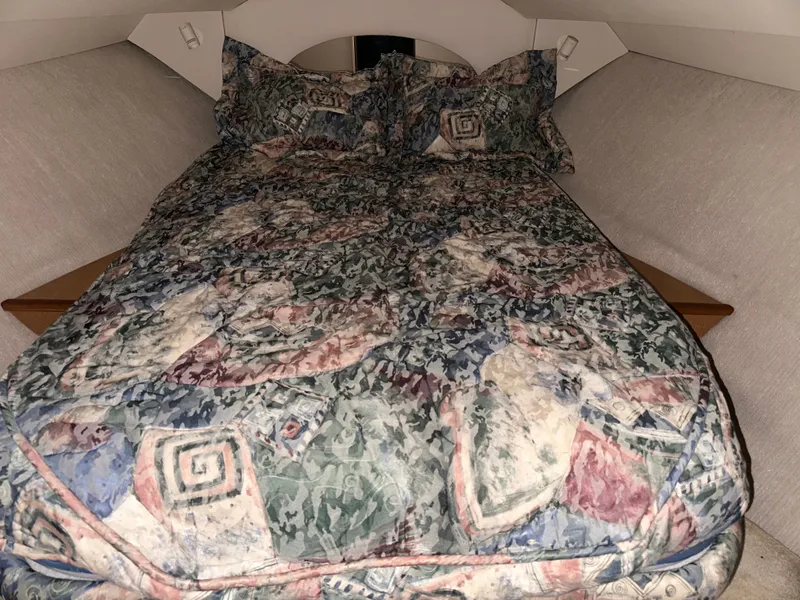 Slide: The Image of Interior of a 1998 Silverton 351 Sedan yacht with cozy bed. - 25