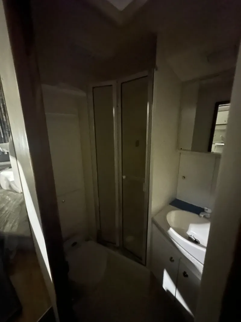 Slide: The Image of 1998 Silverton 351 Sedan bathroom interior view. - 28
