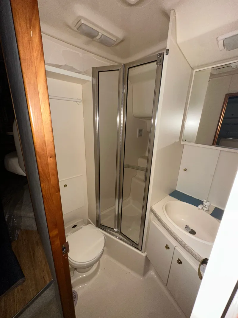 Slide: The Image of Interior view of a 1998 Silverton 351 Sedan yacht bathroom. - 29