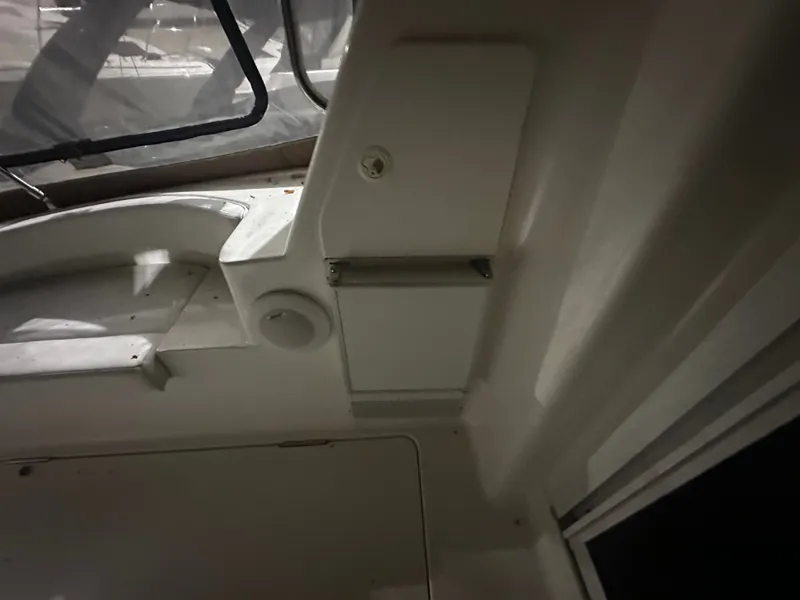 Slide: The Image of Interior of a 1998 Silverton 351 Sedan boat, window and cabinet visible. - 3