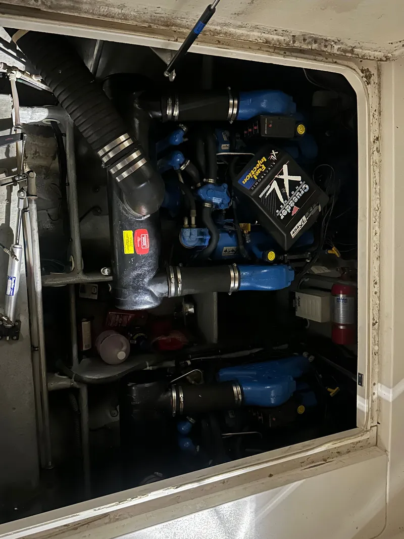 Slide: The Image of Engine room of a 1998 Silverton 351 Sedan with blue components. - 31