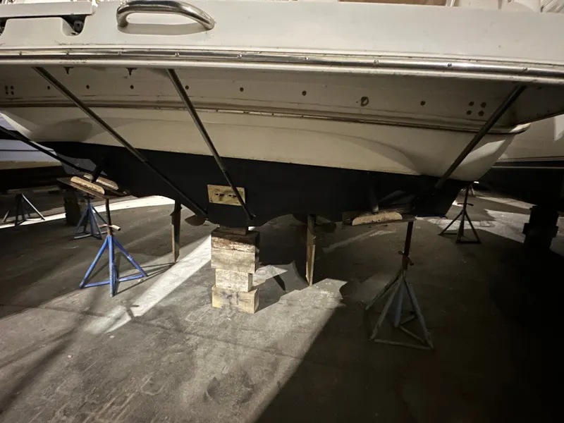 Slide: The Image of 1998 Silverton 351 Sedan propped up in a workshop. - 33