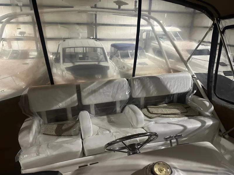 Slide: The Image of Interior of a 1998 Silverton 351 Sedan with white seating. - 8