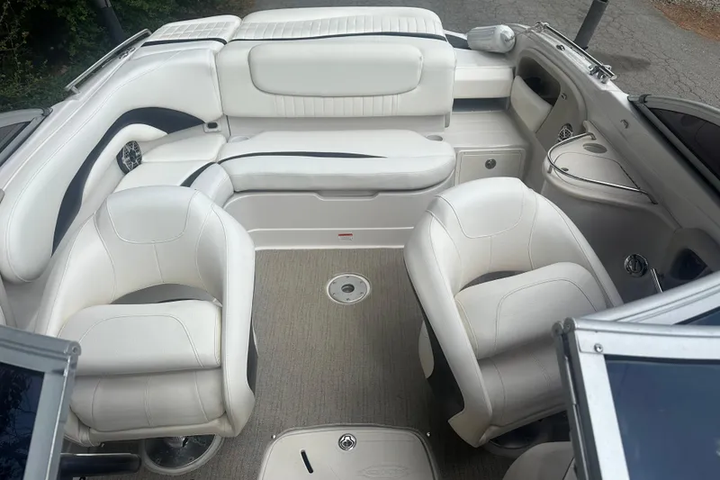 Slide: The Image of Interior of a 2006 Tahoe Q8i boat with white seating and carpeted floor. - 3