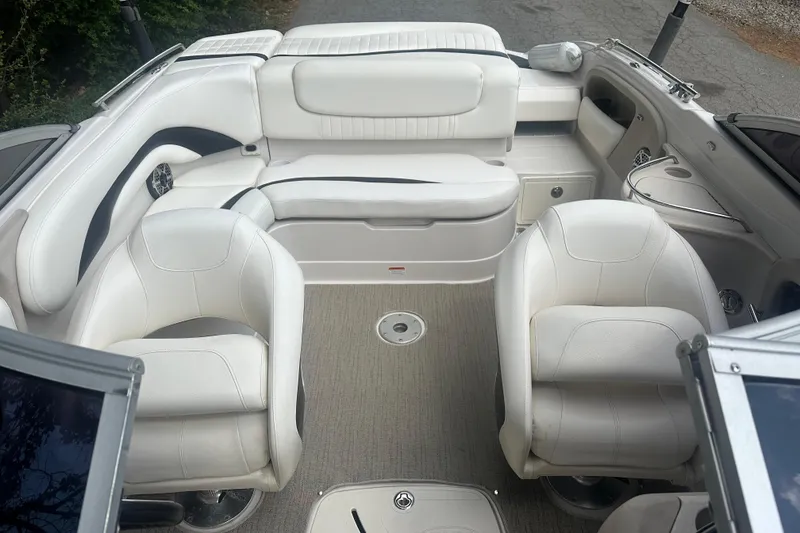 Slide: The Image of 2006 Tahoe Q8i boat interior with white seating and carpeted floor. - 4