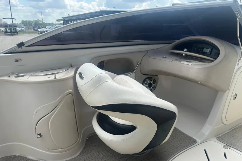 Slide: The Image of Interior of a 2006 Tahoe Q8i boat featuring a sleek captain's chair and dashboard controls. - 7