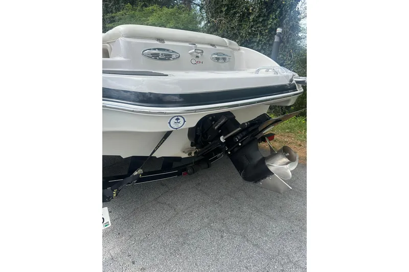 Slide: The Image of 2006 Tahoe Q8i boat rear view with propeller and outboard motor. - 9