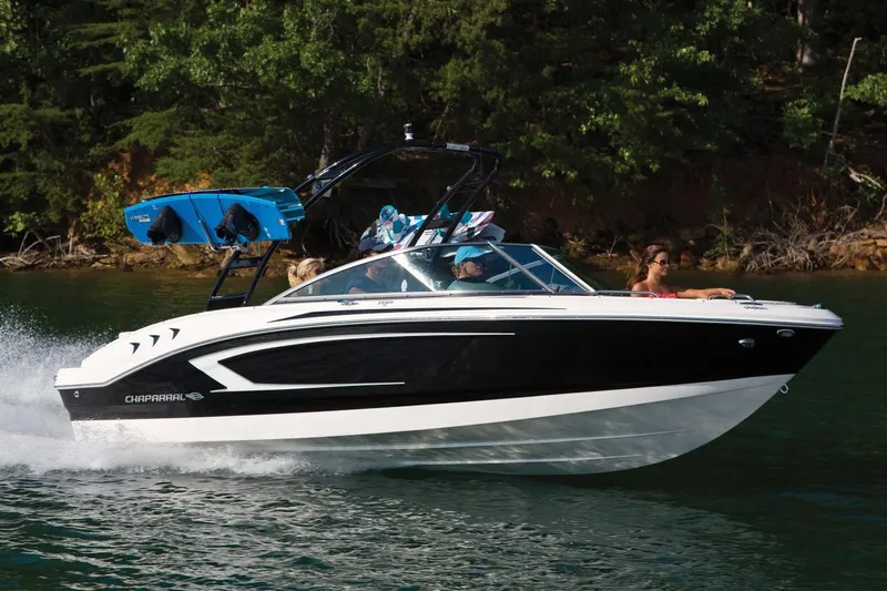Slide: The Image of Manufacturer Provided Image: 2016 Chaparral 21 H2O Sport boat cruising on a lake with passengers. - 19