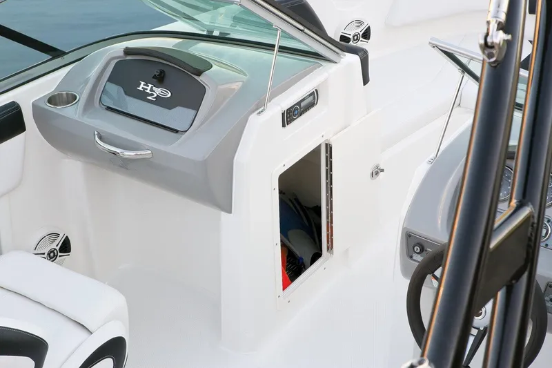 Slide: The Image of Manufacturer Provided Image: 2016 Chaparral 21 H2O Sport boat interior with open storage compartment. - 21
