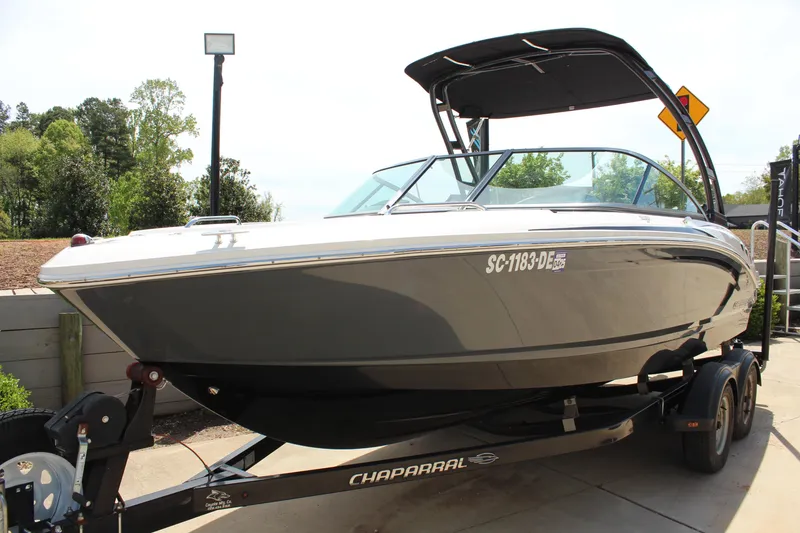 Slide: The Image of 2016 Chaparral 21 H2O Sport boat on trailer, parked outdoors. - 6