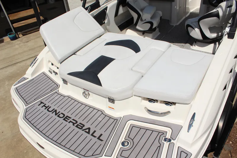 Slide: The Image of 2016 Chaparral 21 H2O Sport boat with cushioned seating and "Thunderball" branding. - 9