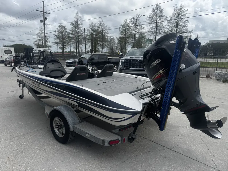 Slide: The Image of 2006 Stratos 285 Pro XL boat with Yamaha engine on trailer. - 8