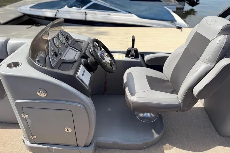 Slide: The Image of Captain's seat and console of 2018 Veranda VR25RC boat at dockside. - 4