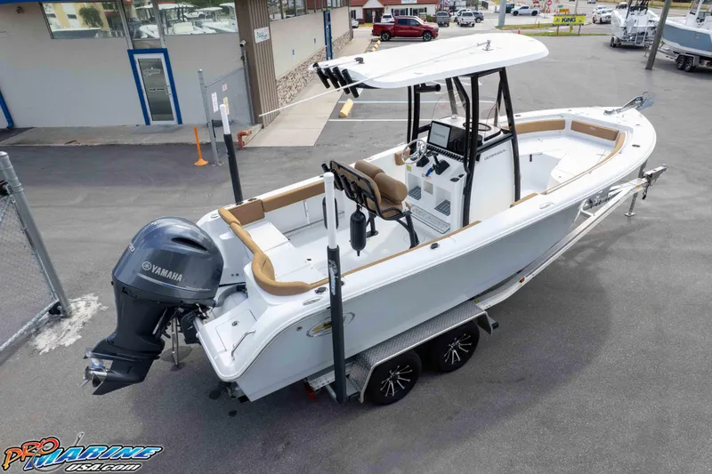 Slide: The Image of 2023 Sea Hunt Ultra 229 boat with Yamaha engine on trailer, parked outdoors. - 10