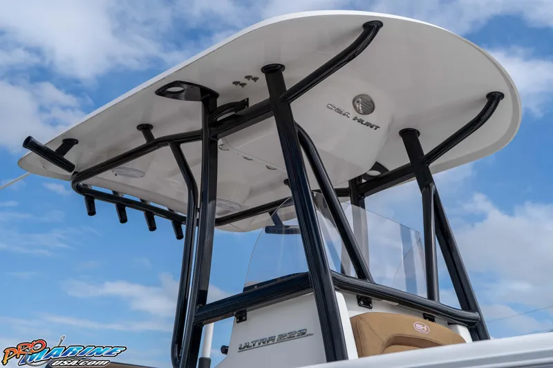 Slide: The Image of 2023 Sea Hunt Ultra 229 T-top against a blue sky background. - 25