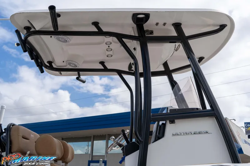 Slide: The Image of 2023 Sea Hunt Ultra 229 boat with T-top and seating, viewed from below. - 28